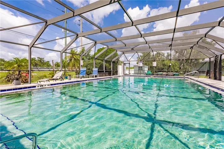 Heated and fully screened community swimming pool with a lanai
