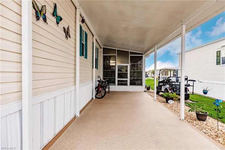 View of patio / terrace with a carport