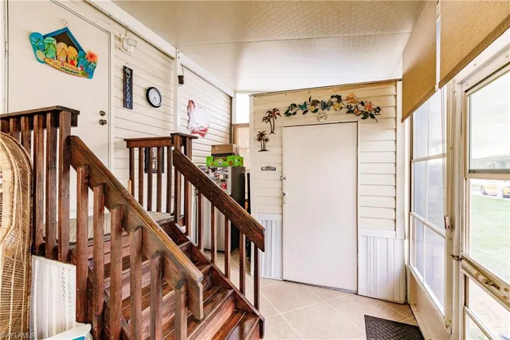 Stairs to lanai and storage shed- all covered, all screend, and air conditioned plus extra refrigerator & ceiling fan