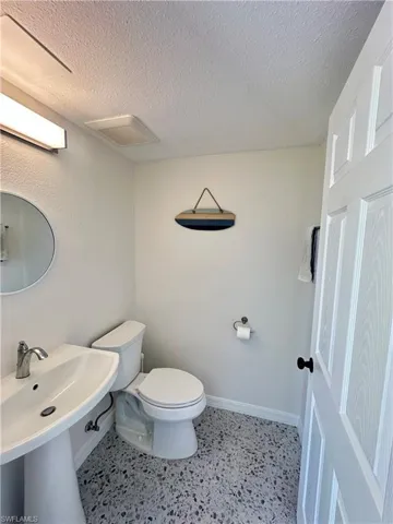 Doorway to property with stucco siding