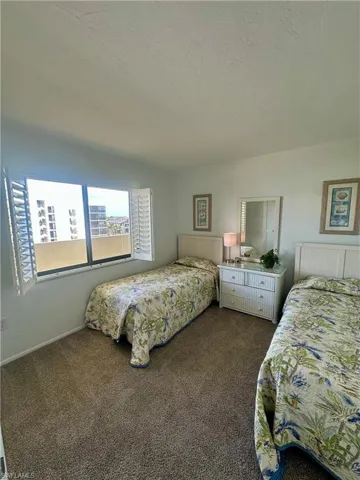 Bathroom featuring visible vents, toilet, tile patterned flooring, and enclosed tub / shower combo