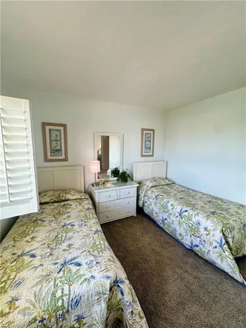 Bathroom featuring baseboards, visible vents, tile patterned floors, and vanity