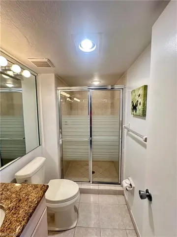 Carpeted bedroom with baseboards