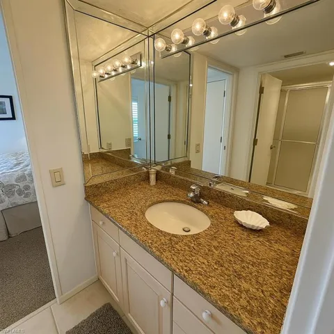 Carpeted bedroom featuring a textured ceiling