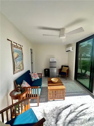 Property entrance with ac unit and stucco siding