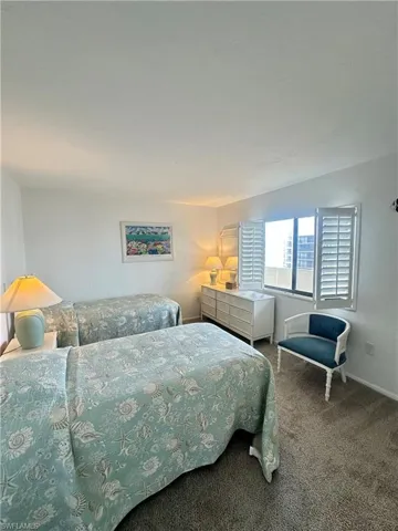 Bedroom with dark carpet