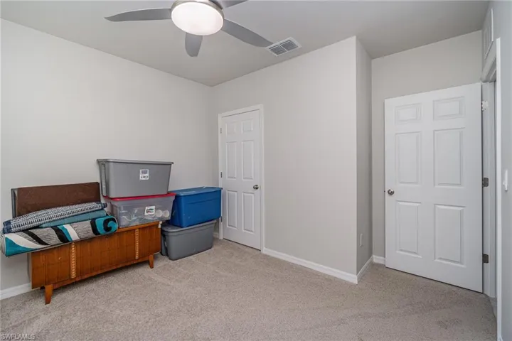 Bedroom 2 with carpet and ceiling fan