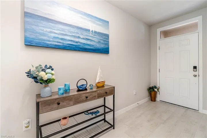 Entrance foyer with light plank tile flooring