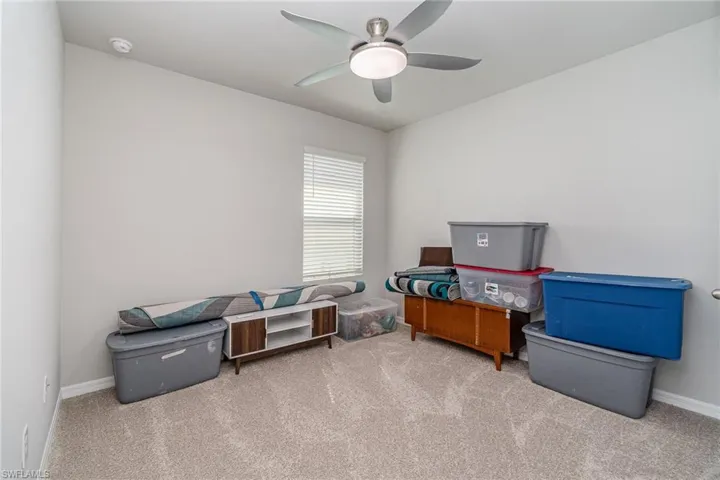 Bedroom 2 room with carpet and ceiling fan