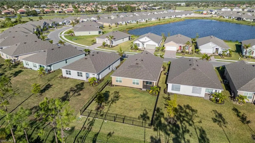 Rear aerial view with fence