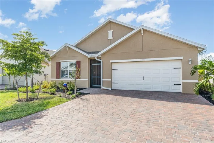 View of front of property featuring a garage