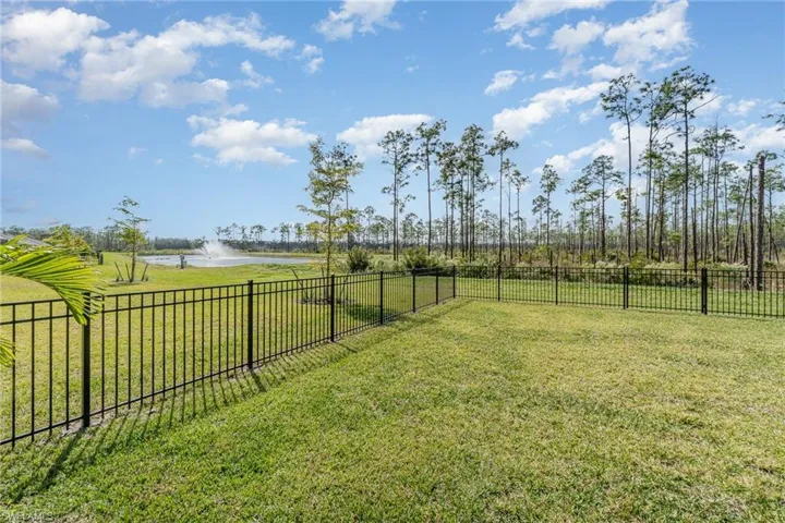 View of yard featuring a water and preserve view