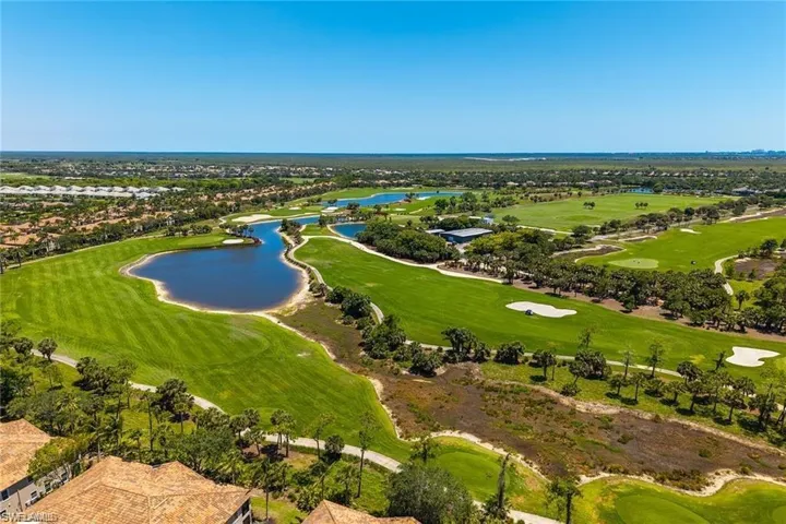 Drone / aerial view of a large body of water and a golf club