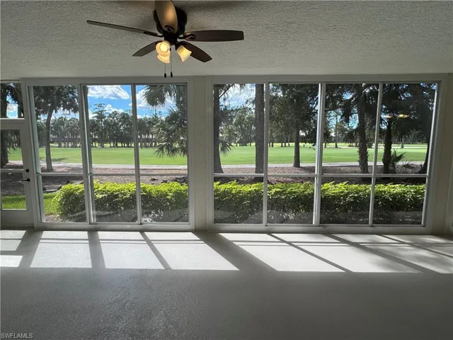 Unfurnished Lanai featuring ceiling fan and golf course view