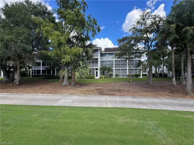 View of property's community featuring a lawn