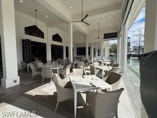 Wooden deck featuring a patio, outdoor dining area, and ceiling fan
