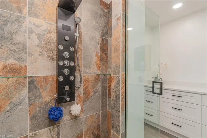 Bathroom with walk in shower and delux shower tower for pure relaxation