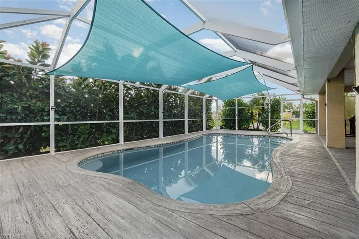 View of swimming pool  and shade tent for pool
