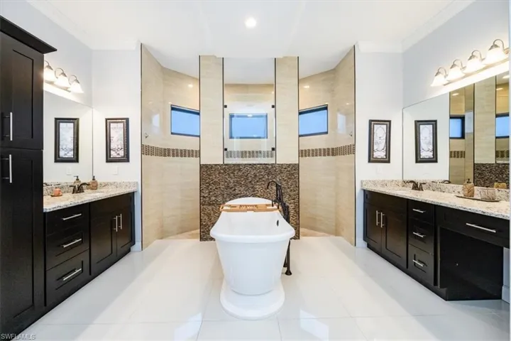 Master Bathroom with an enormous shower, separate tub and his/hers sinks