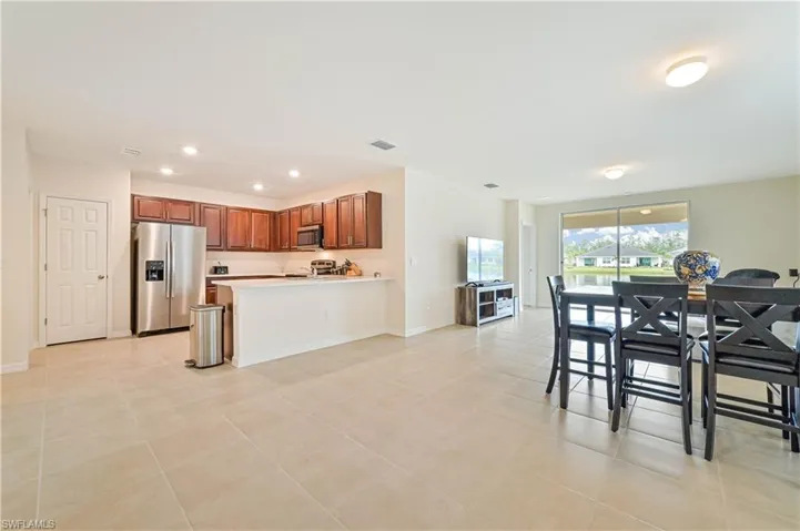 Kitchen featuring appliances with stainless steel finishes and light tile patterned floors