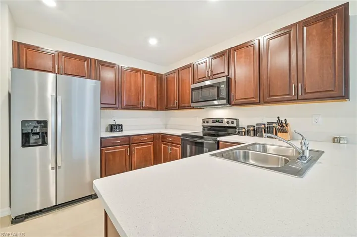 Kitchen featuring stainless steel appliances and sink