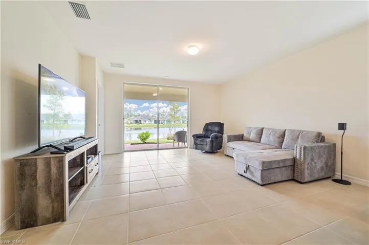 Living room featuring light tile patterned flooring