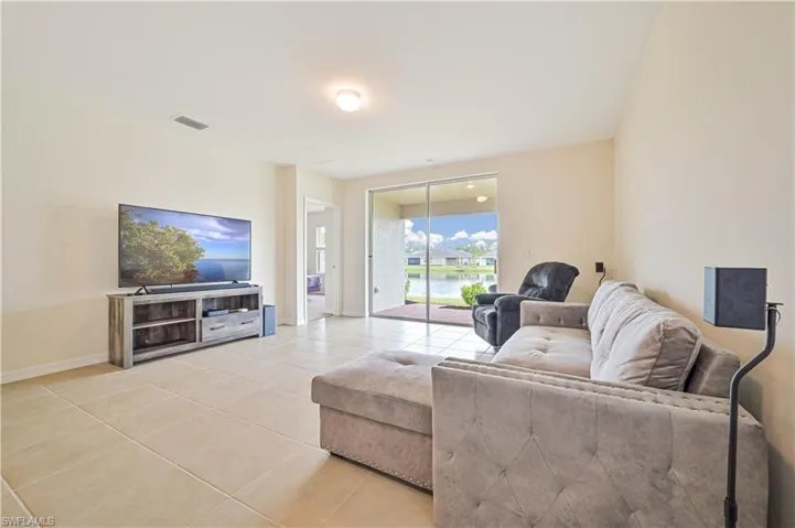 Living room with light tile patterned floors