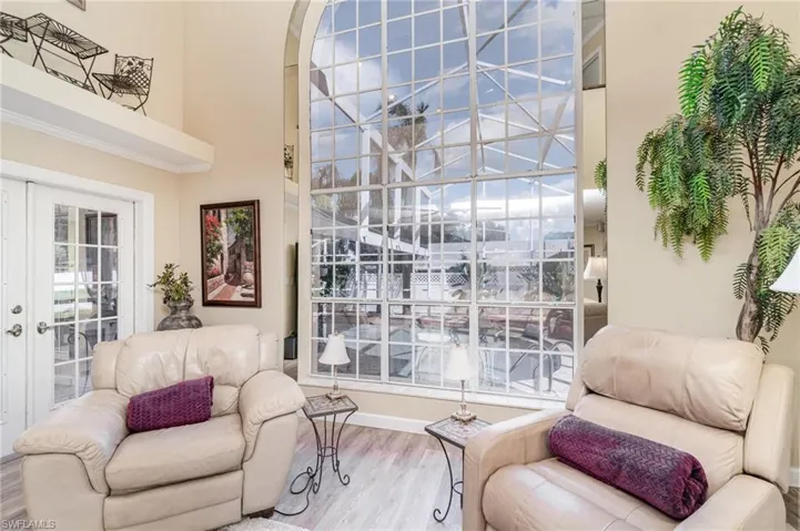 Living area featuring wood finished floors and french doors