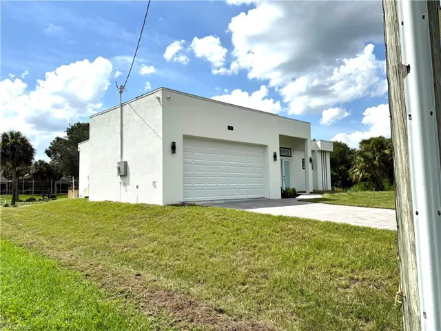 Garage featuring driveway