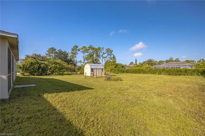 View of yard with a shed