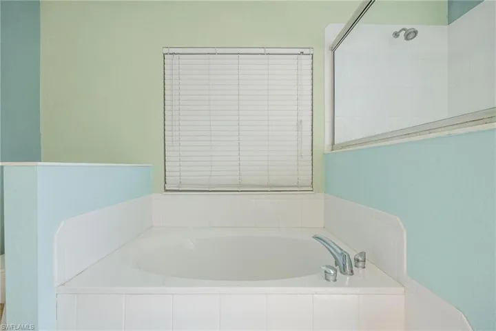 Bathroom with tiled bath