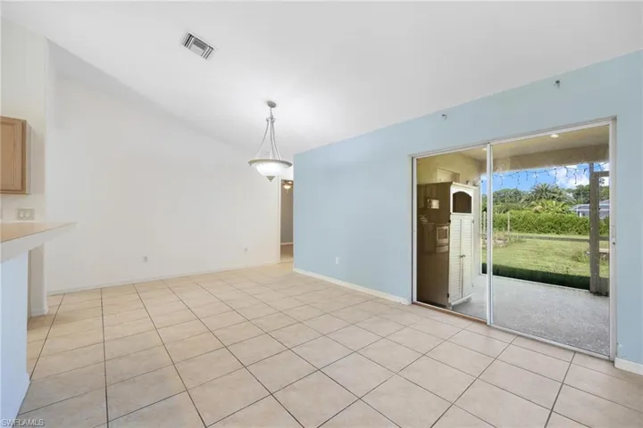 Unfurnished living room featuring light tile patterned floors