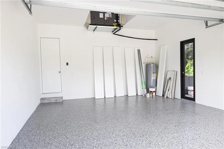 Garage featuring water heater