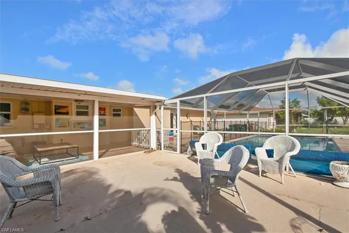 View of patio with a lanai and a sunroom