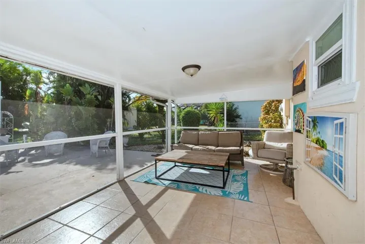 Sunroom with an outdoor hangout area