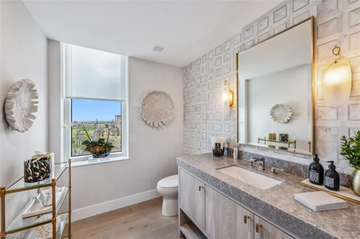 Bathroom with vanity and light wood finished floors