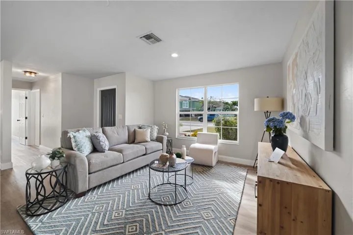 Living room with light wood-type flooring