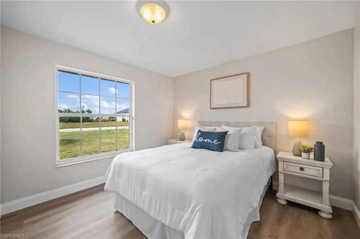 Bedroom with hardwood / wood-style floors