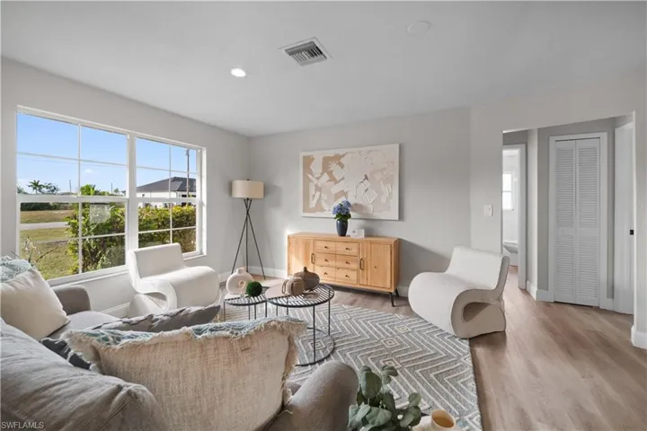 Living room with hardwood / wood-style floors