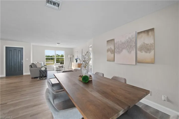 Dining room with light hardwood / wood-style floors