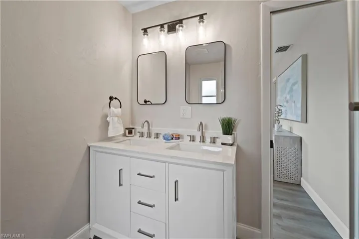 Bathroom featuring wood-type flooring and vanity