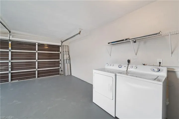 Laundry area with washer and clothes dryer