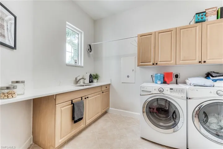 The large laundry room has also been upgraded with quartz countertop