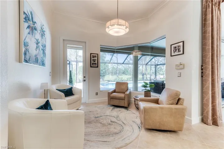 Breakfast room by the frameless corner now used as a comfortable conversation area