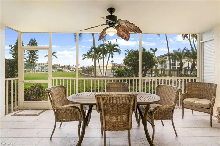 Sunroom featuring ceiling fan