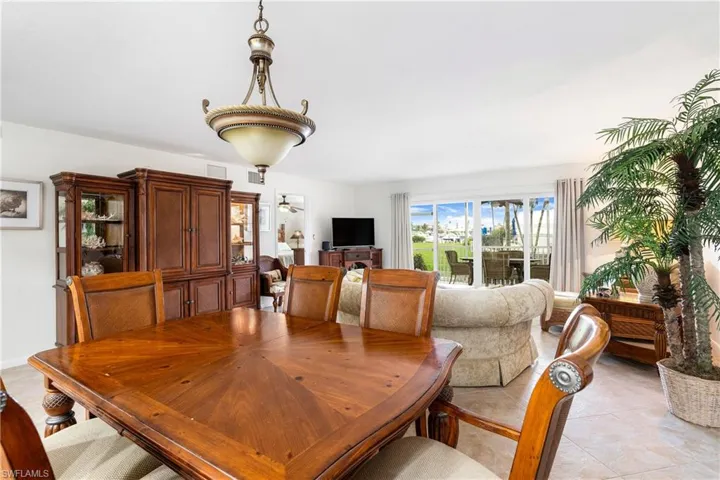 Dining area with light tile patterned floors