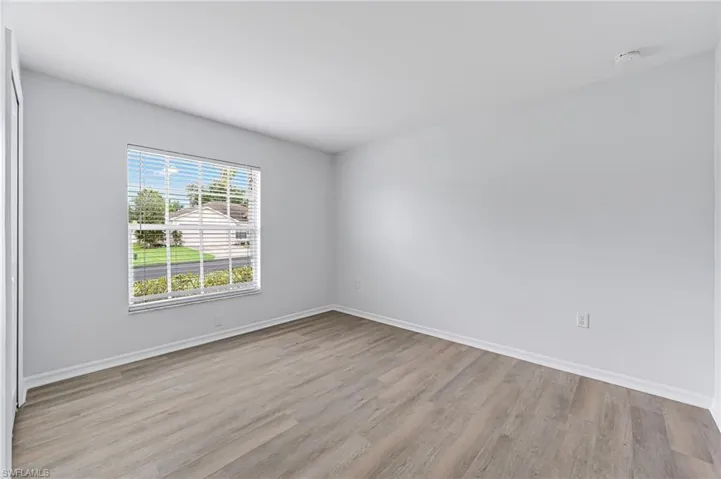 Empty room featuring light wood-type flooring