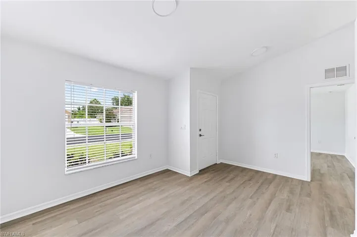 Spare room with light hardwood / wood-style flooring