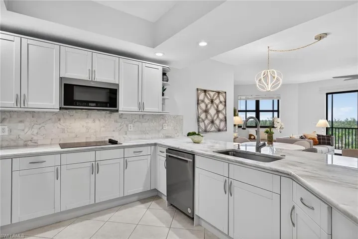 Kitchen featuring recessed lighting, open shelves, white cabinetry, backsplash, and appliances with stainless steel finishes