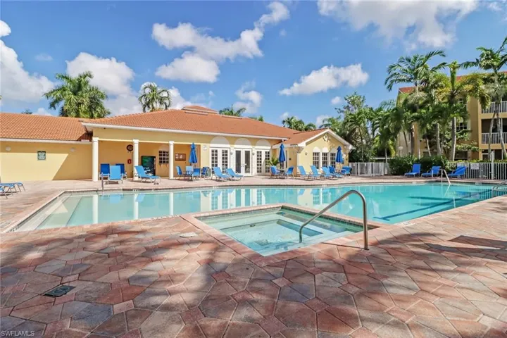 Community pool with a community hot tub, a patio area, and french doors